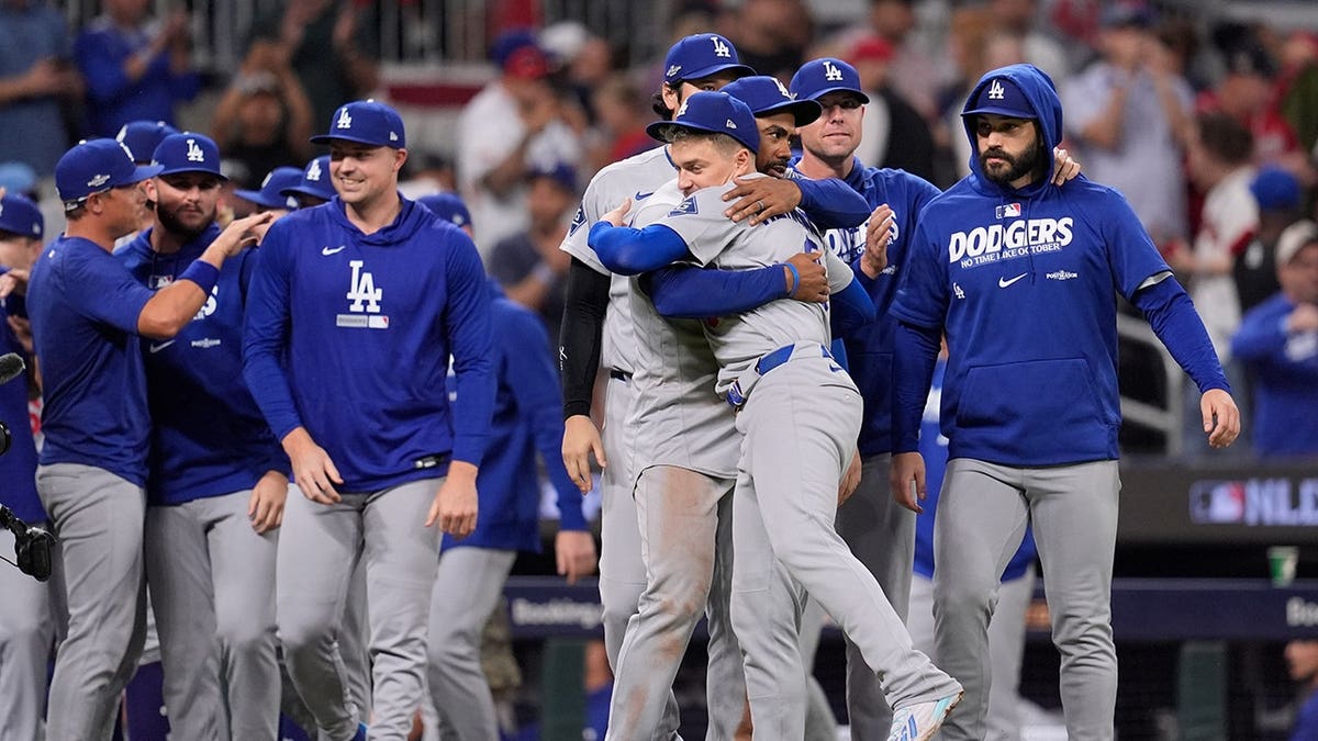 Los Angeles Dodgers celebrate after winning Game 4 of the National League Division Series against the Atlanta Braves.