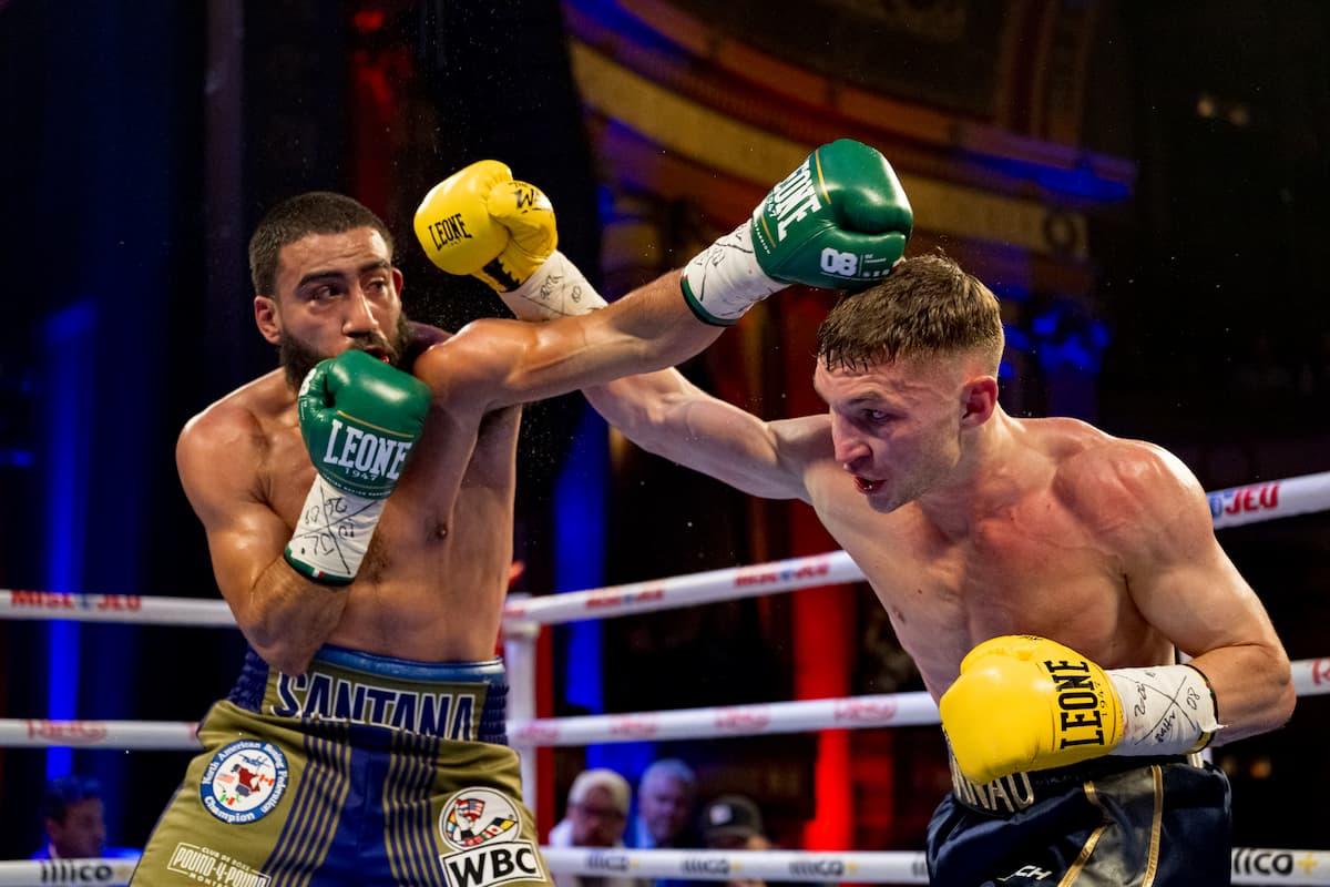 Luis Santana and Dzmitry Asanau exchange punches during their bout