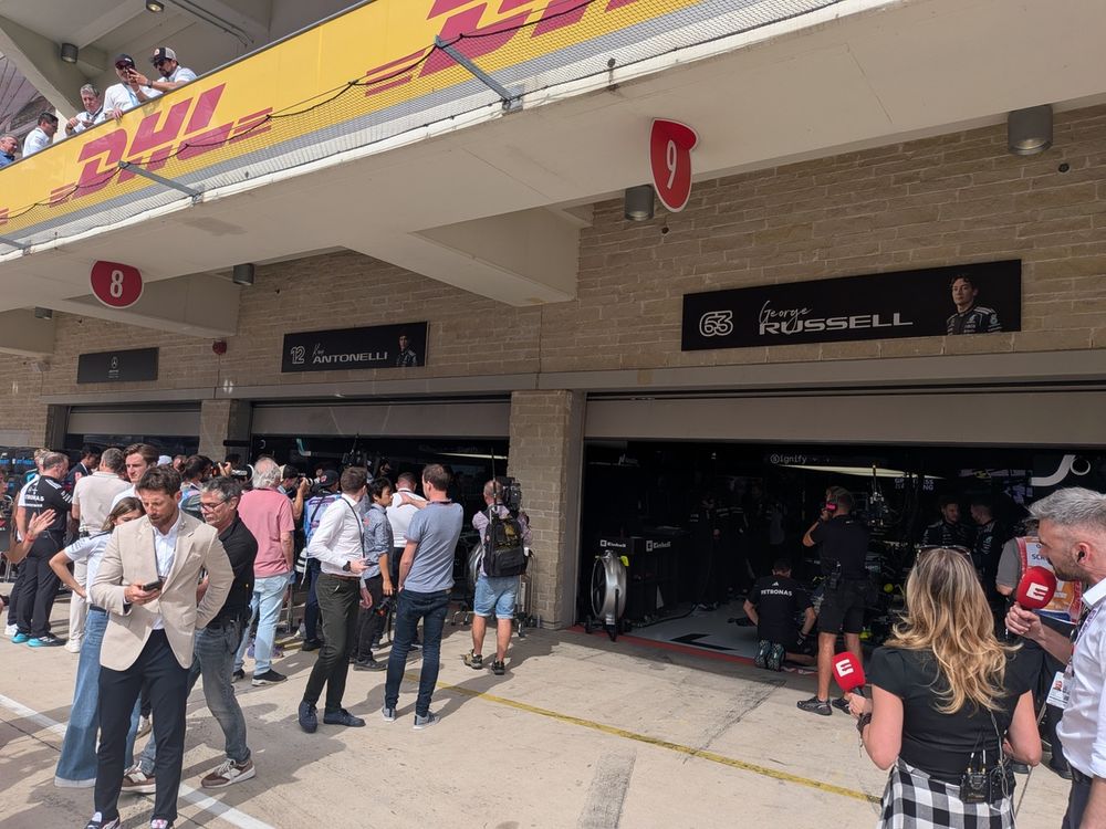 Mercedes garages before the start of the race, as media gravitate towards champion-elect Antonelli