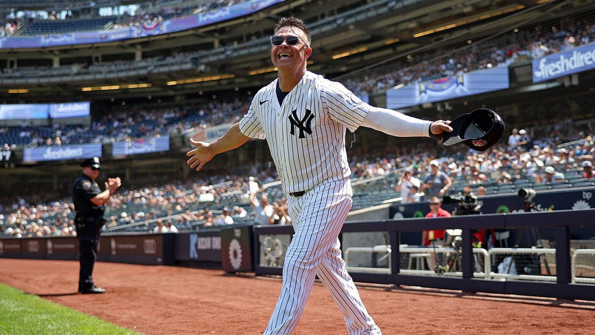 Nick Swisher stands on the field during Yankees Old-Timers' Day at Yankee Stadium.