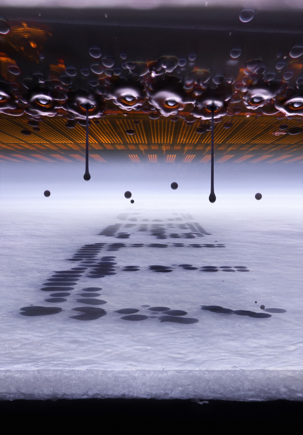 Microscopic view of an inkjet printer depositing ink on paper.