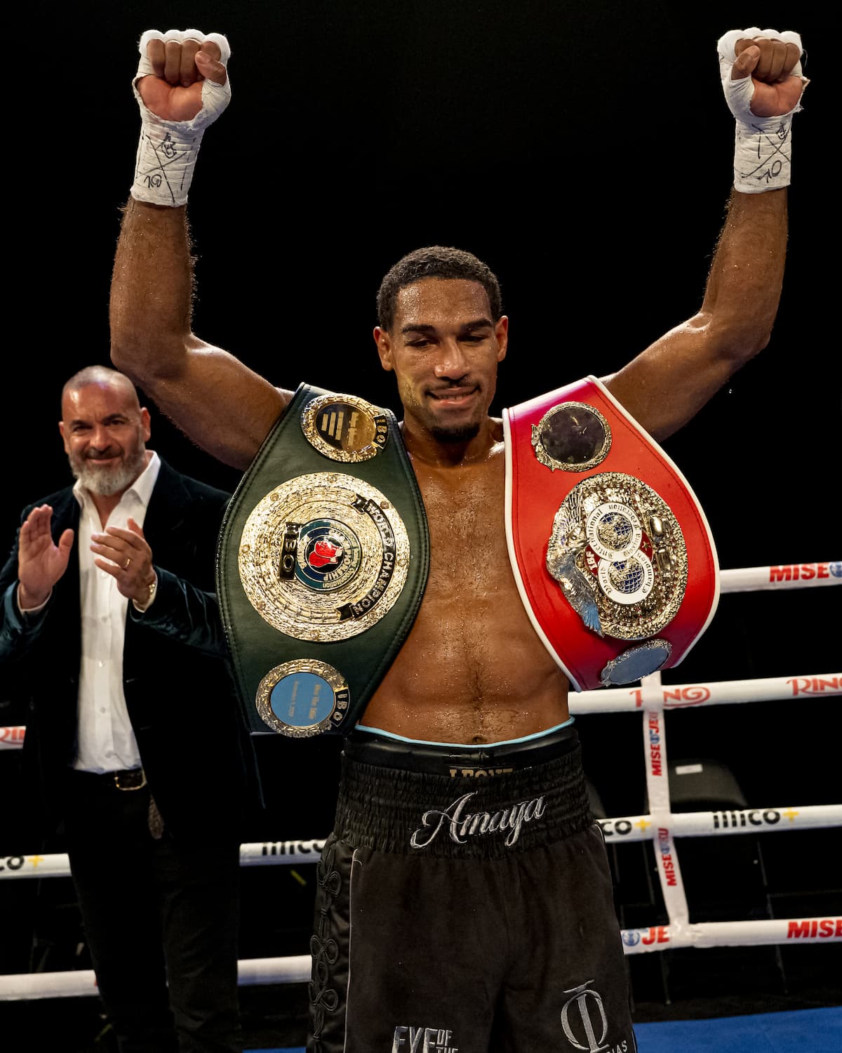 Osleys Iglesias has his hands raised with his championship belts on his shoulders following his victory over Oliver Zaren