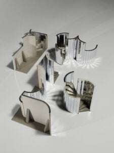 A scale model of a maze made from mirrored partitions