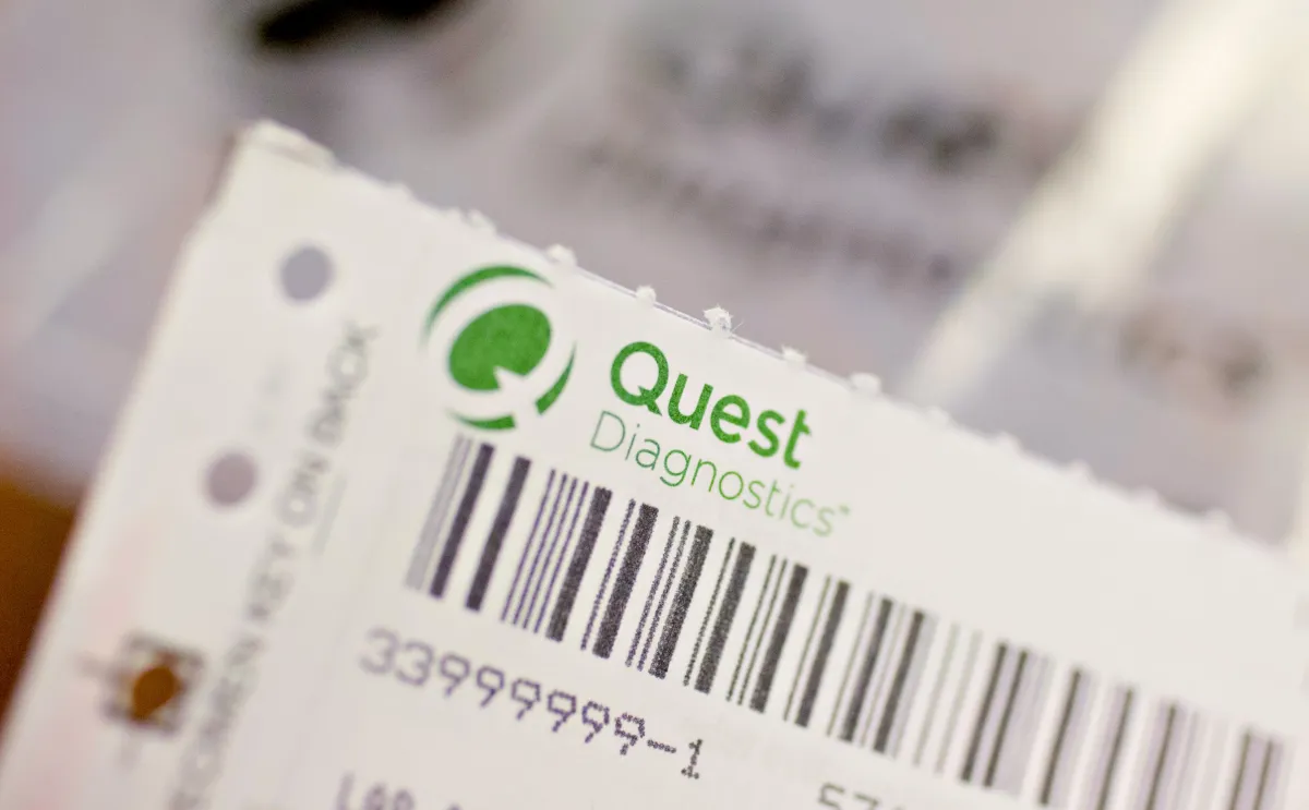 A Quest Diagnostics Inc. requisition form is displayed for a photograph at Perry Memorial Hospital in Princeton, Illinois.