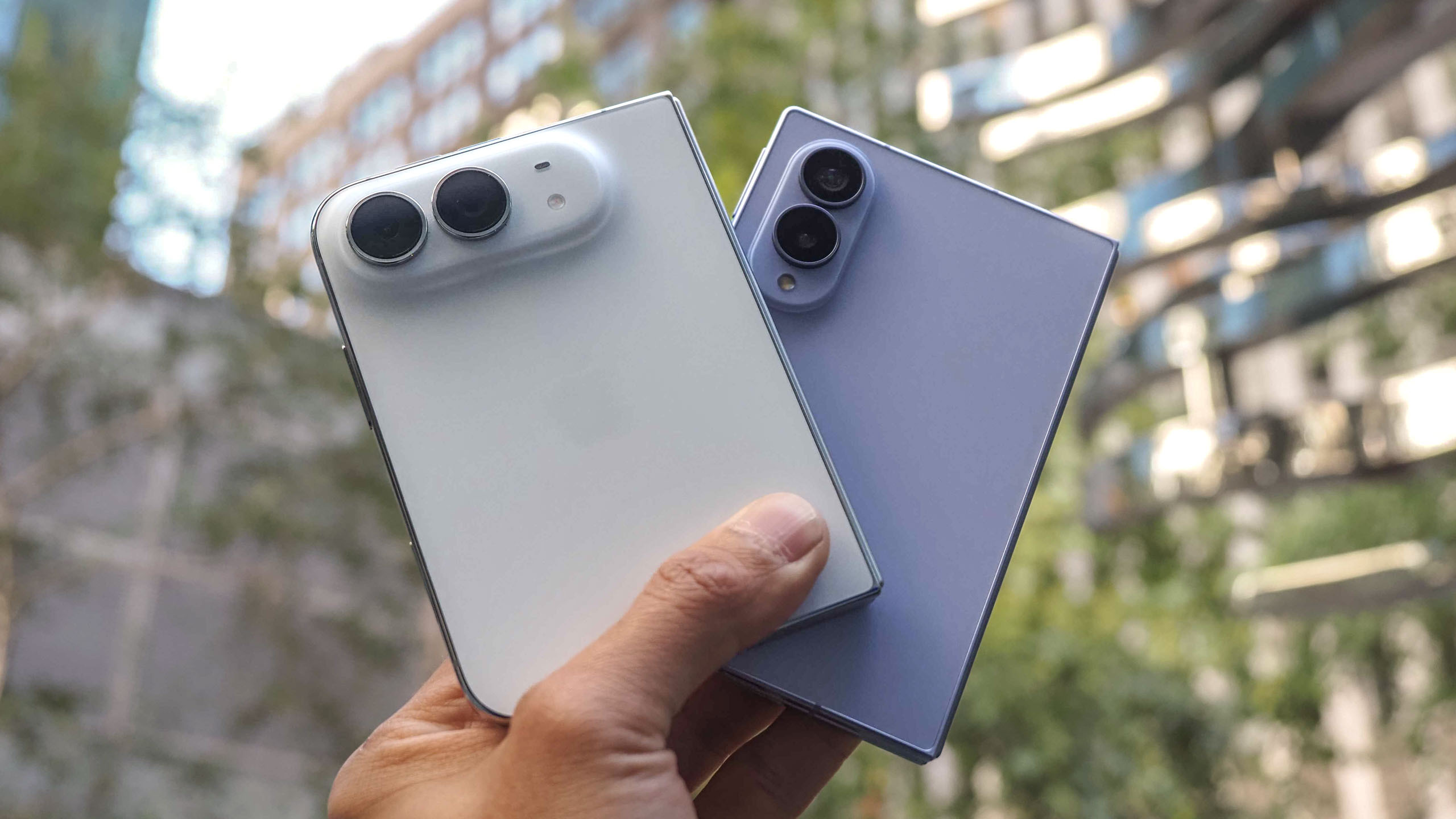 iPhone Duo vs. Galaxy Z Fold 8 held in the hand.