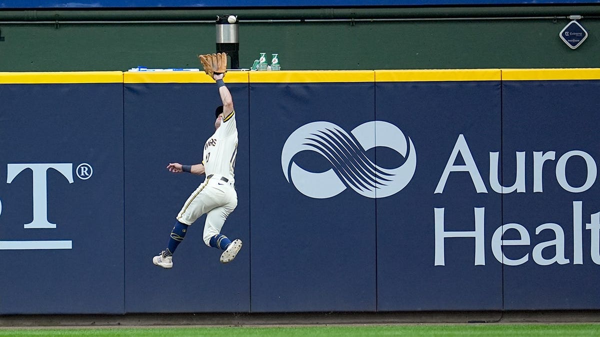 Sal Frelick catches a fly ball during Game 2 of the National League Championship Series.