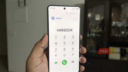 Samsung phone in hand showing dial code