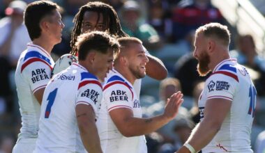 England's Mikey Lewis is congratulated after coming off the bench to score two tries against France at the Rugby League World Cup