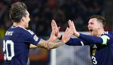 Kieron Bowie (L) celebrates his first Scotland goal with captain Andy Robertson