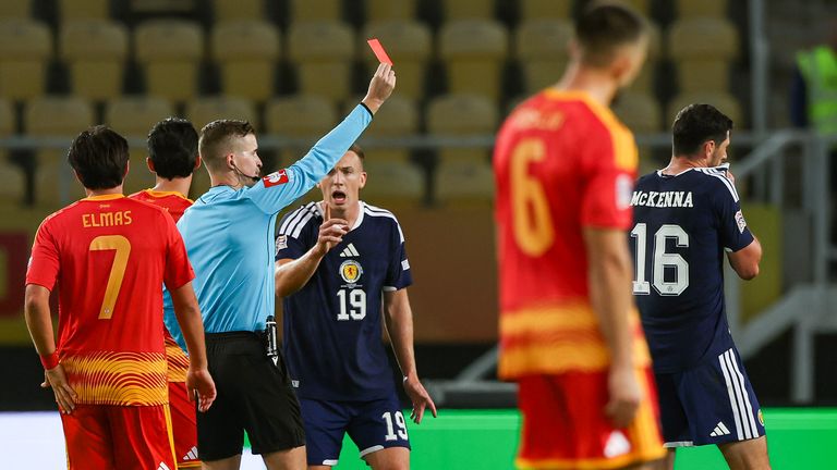 Scotland's Scott McKenna (R) was sent off late on