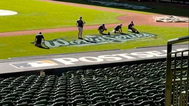 Brewers grounds crew paints 'World Series' onto field