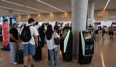 Passengers check in for the first flight from Western Sydney International Airport
