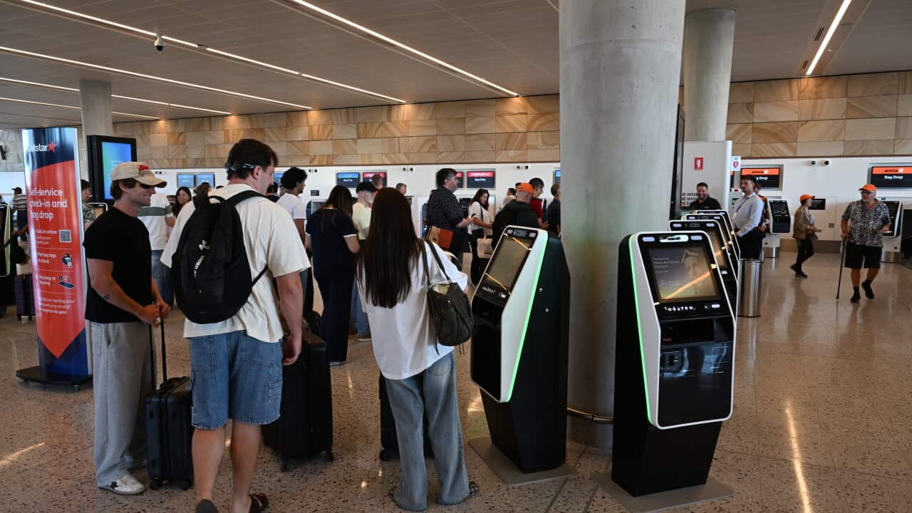 Passengers check in for the first flight from Western Sydney International Airport