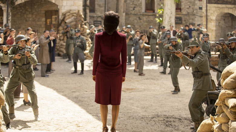 Maeve surrounded by German WWII soldiers in 