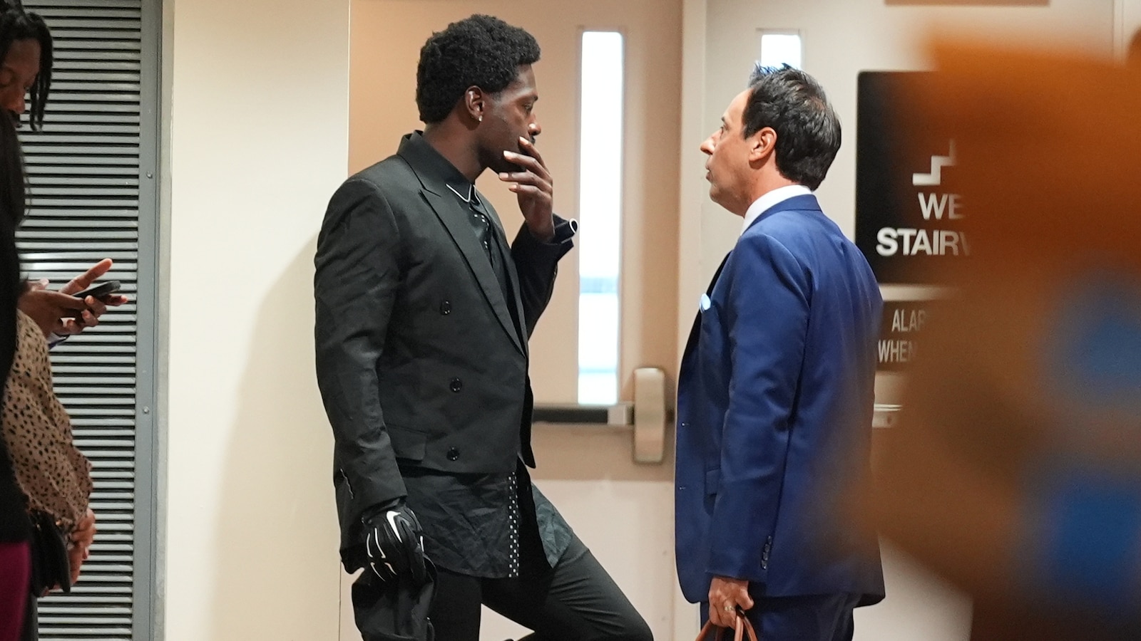 Ex-NFL star Antonio Brown appears in court, judge delays hearing on expected deal