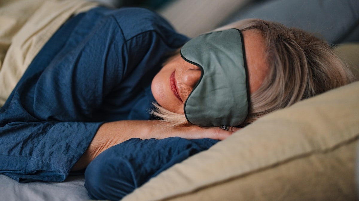 woman sleeping with mask