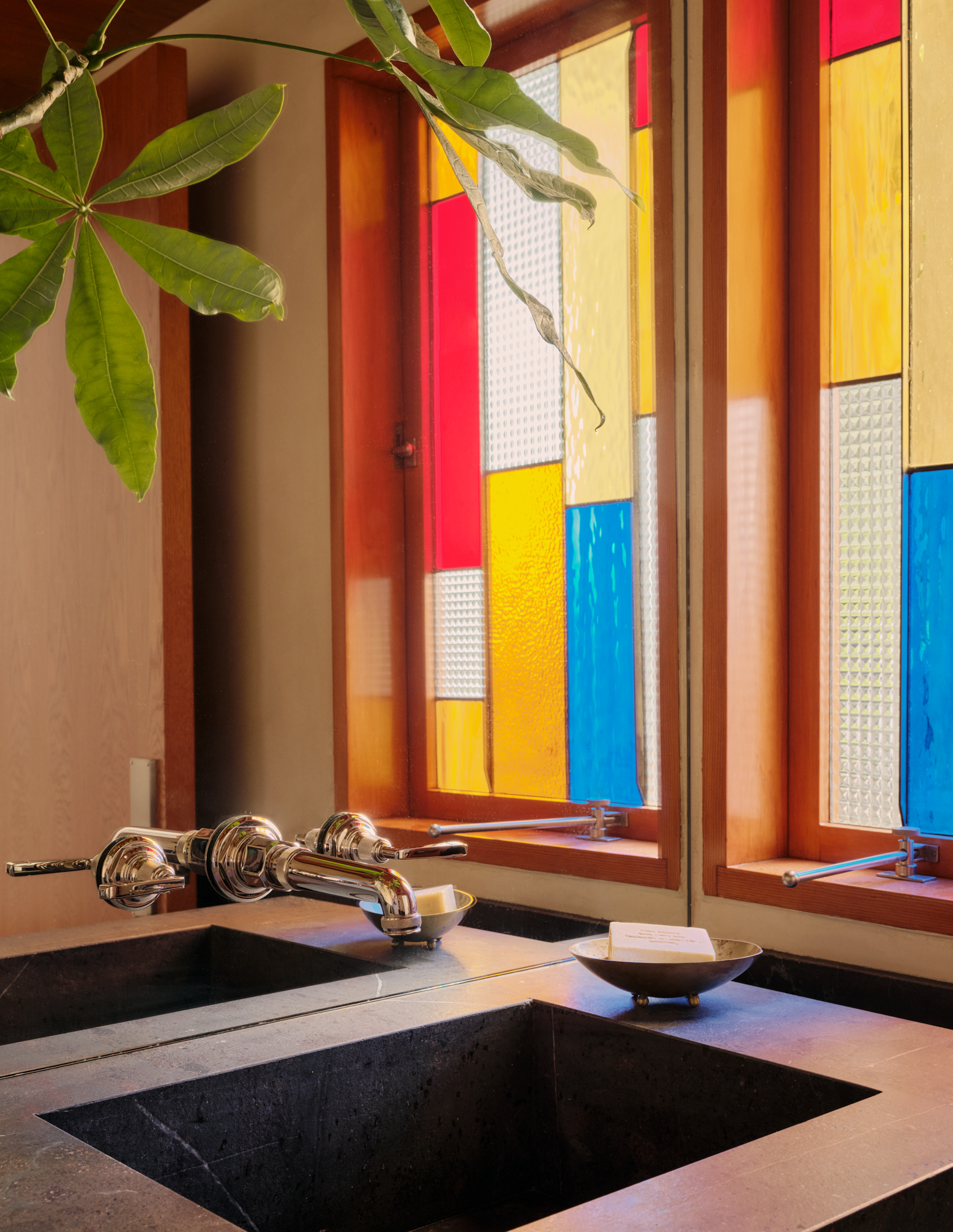 bathroom sink with stained glass window