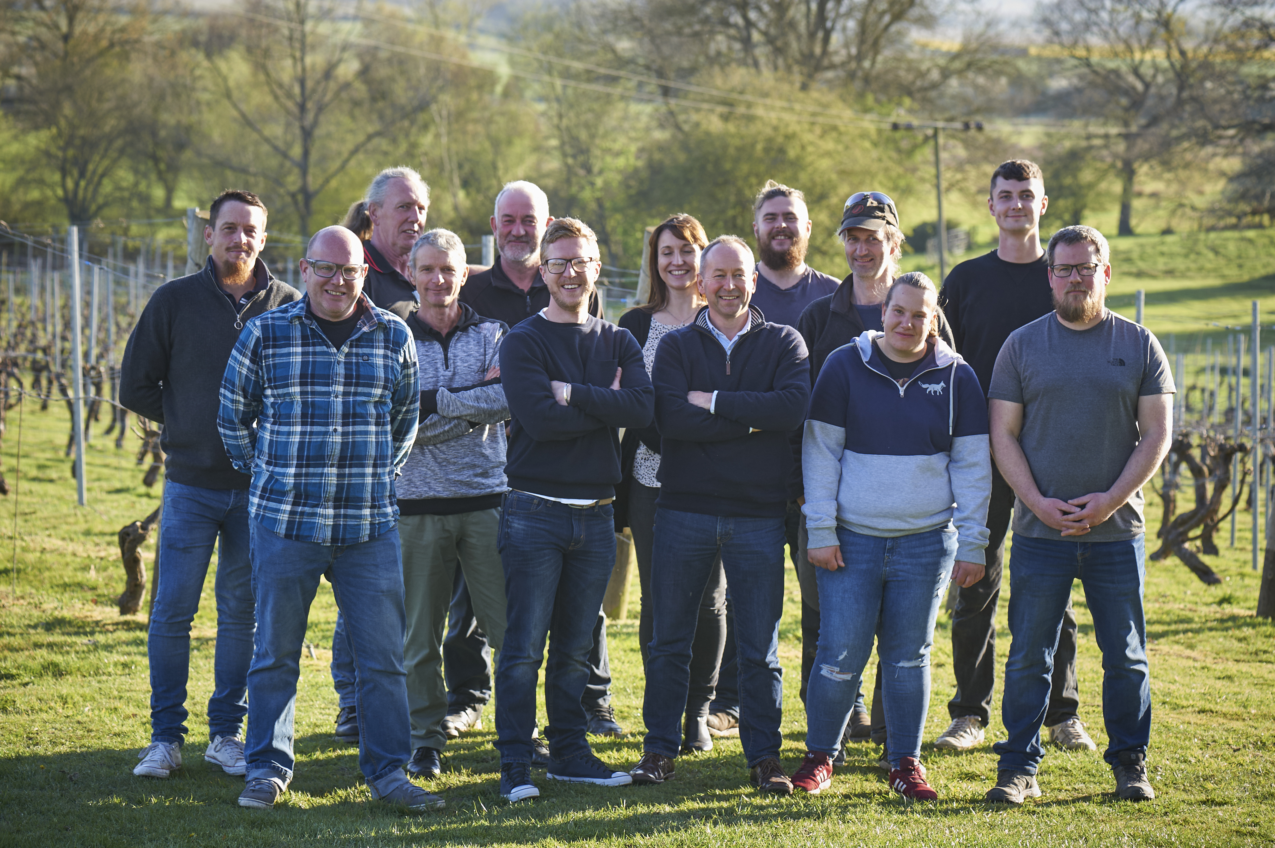 Group photo of Chapel Down team in front of vineyards.