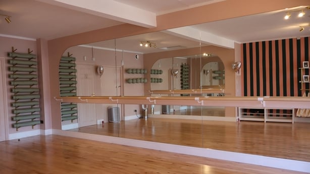 A barre studio with pink walls