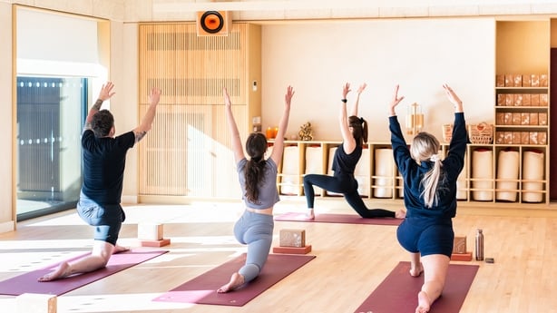 a group of people doing yoga
