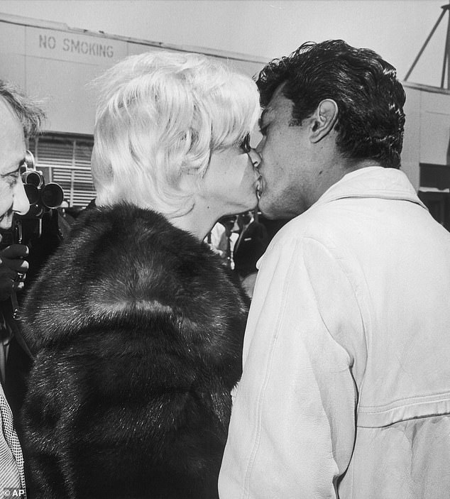 Mansfield and Sardelli seen sharing a kiss at San Francisco International Airport in May 1963