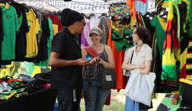 Warren Benns (left), owner of Natural Mystic shares a laugh with Stacey (middle) and Izzy Eaton at the Naija Market in Princess Park Saturday afternoon in downtown Brandon. (Michele McDougall/The Brandon Sun)