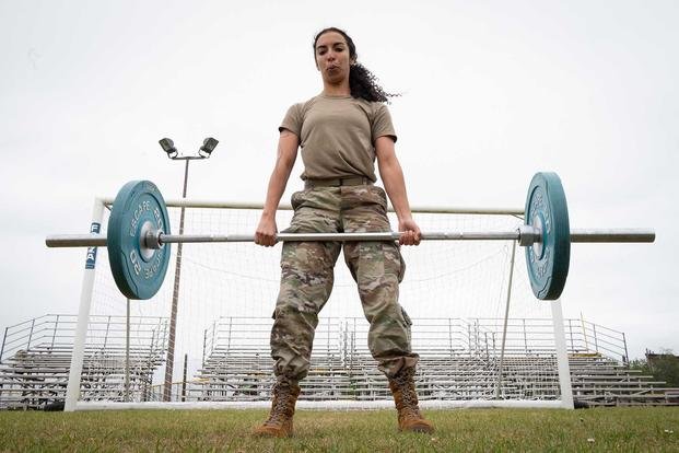 U.S. Air Force 1st Lt. Cristina Jourden, 423rd Communications Squadron flight commander, performs deadlifts as part of the Defender Challenge on RAF Alconbury, England.