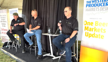 Left to right: Bruce Burnett, Jerry Klassen and Ranulf Glanville talk markets at the Ag in Motion farm show near Langham, Sask.
