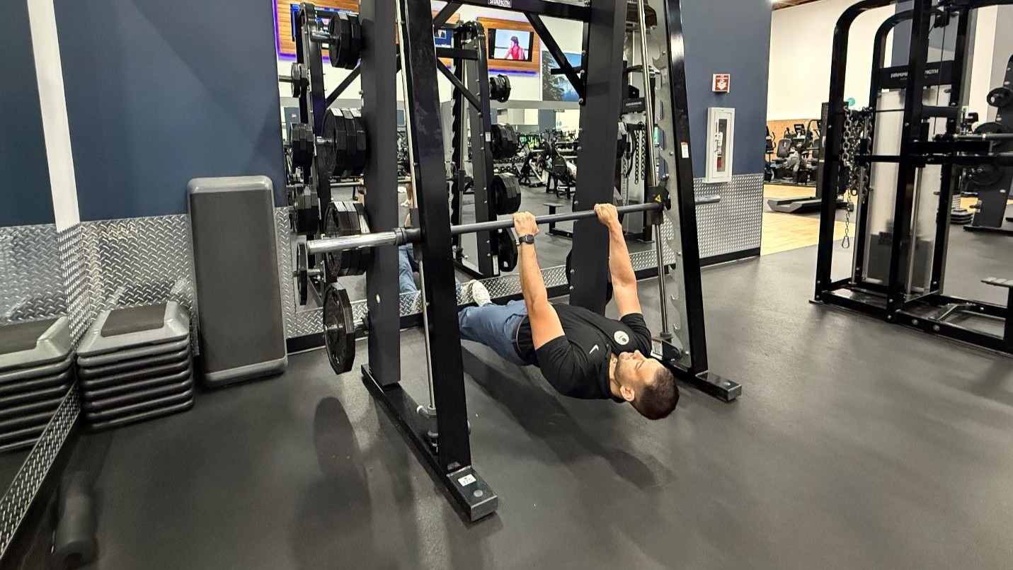 man doing exercise in the gym