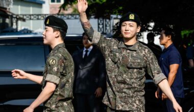 Jungkook of K-pop supergroup BTS waves as he departs from an outdoor sporting facility in Yeoncheon on June 11, 2025, shortly after his release from 18 months of South Korean military service.