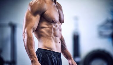 a photo of a man in the gym with strong abs