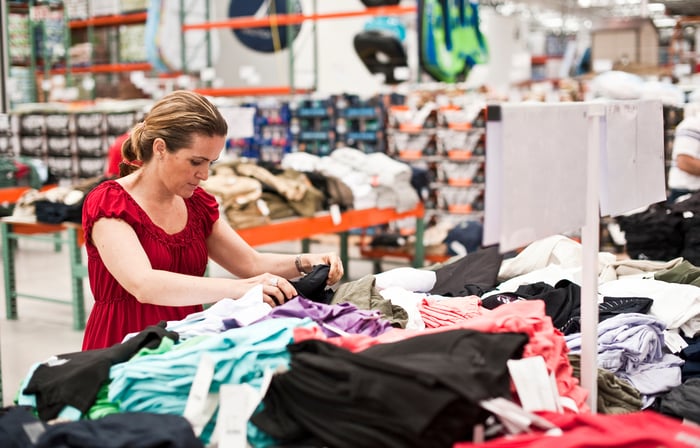 A person looking at clothes.