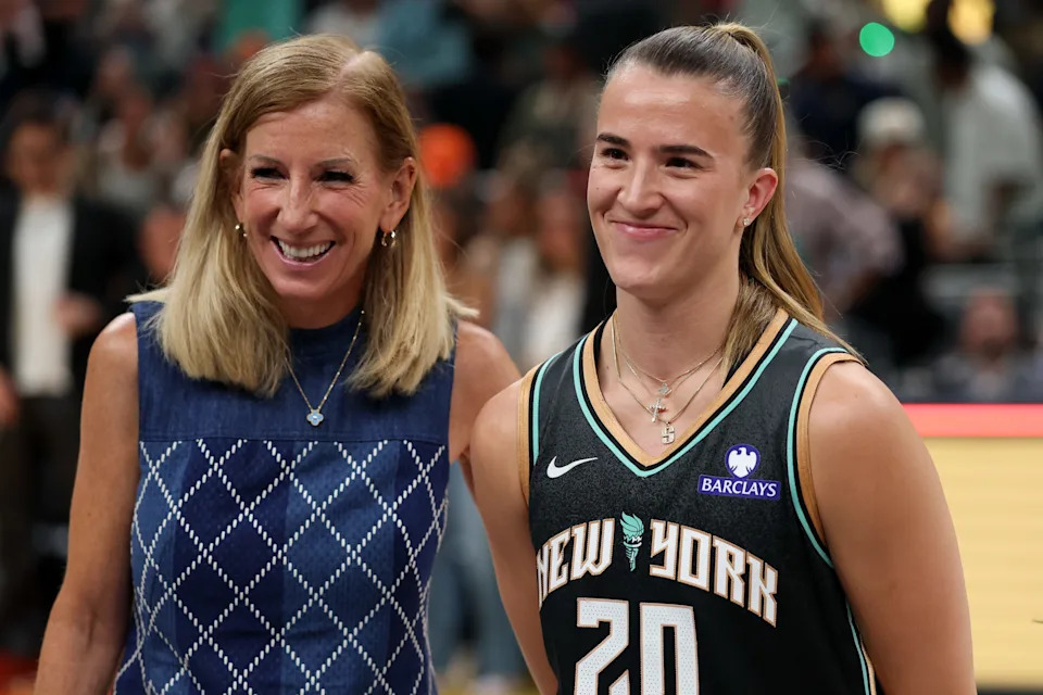 Jul 18, 2025; Indianapolis, IN, USA; New York Liberty guard Sabrina Ionescu receives her trophy from WNBA commissioner Cathy Engelbert for the three-point contest during the 2025 WNBA All Star Skills Challenge at Gainbridge Fieldhouse. Mandatory Credit: Trevor Ruszkowski-Imagn Images