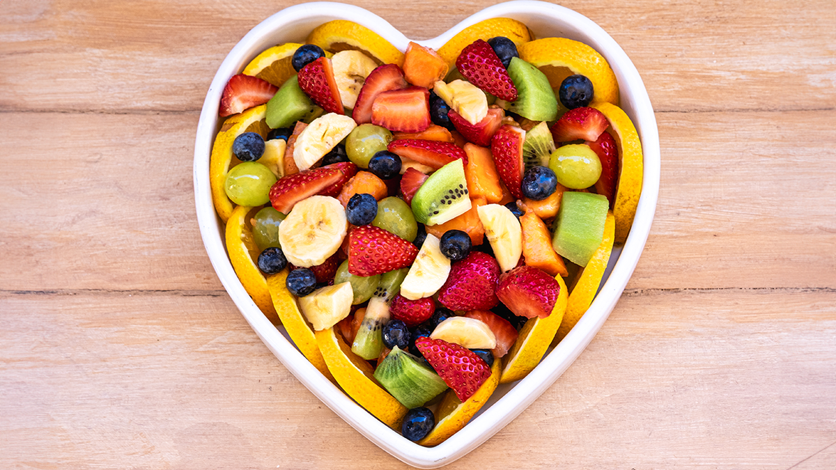 variety of fruit in a heart-shaped bowl