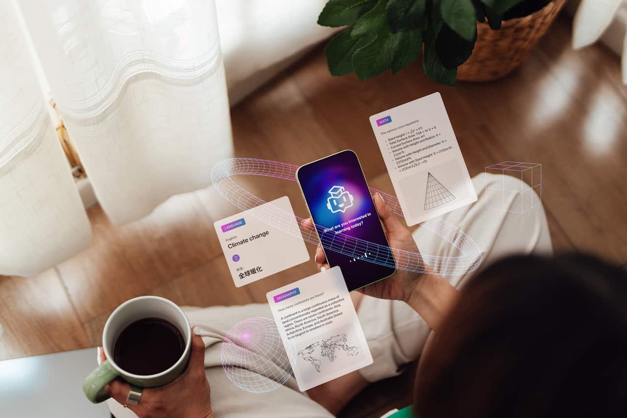 A person holds a smartphone in their hand that is surrounded with images of web pages. 