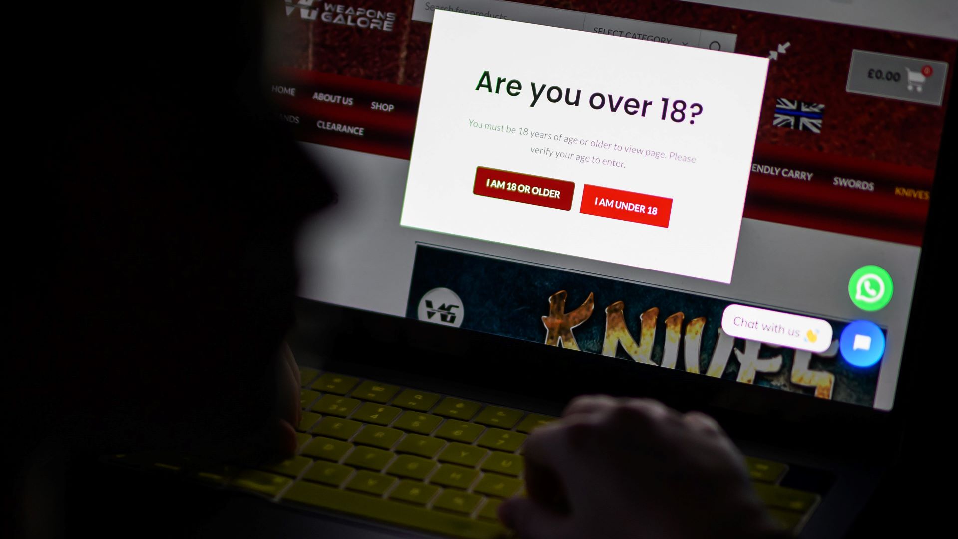 In this photo illustration, a teenage child looks at a screen of age-restricted content on a laptop screen