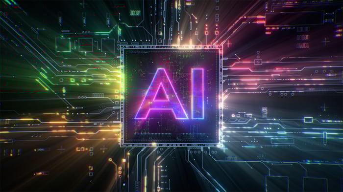 Image of the letters AI on a circuit board with light surrounding it.