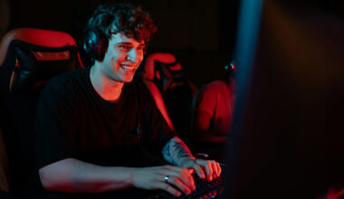 Man wearing headphones at computer desk