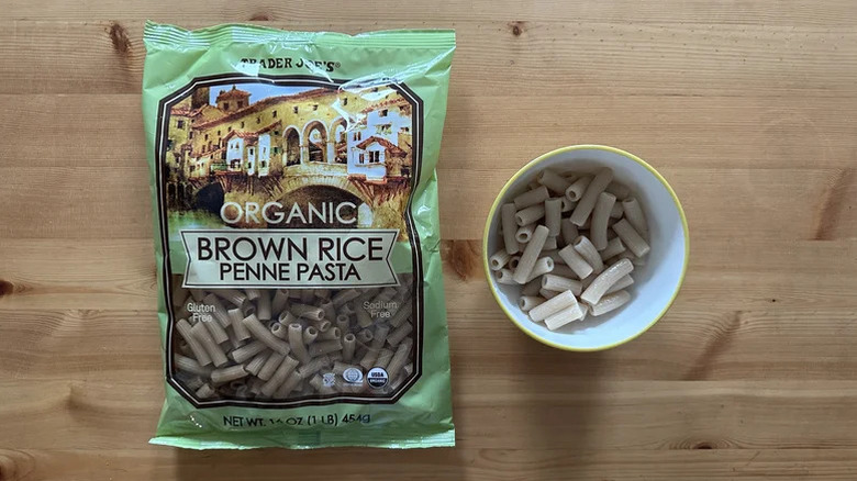 TJ's Organic brown rice penne pasta in a bag and bowl