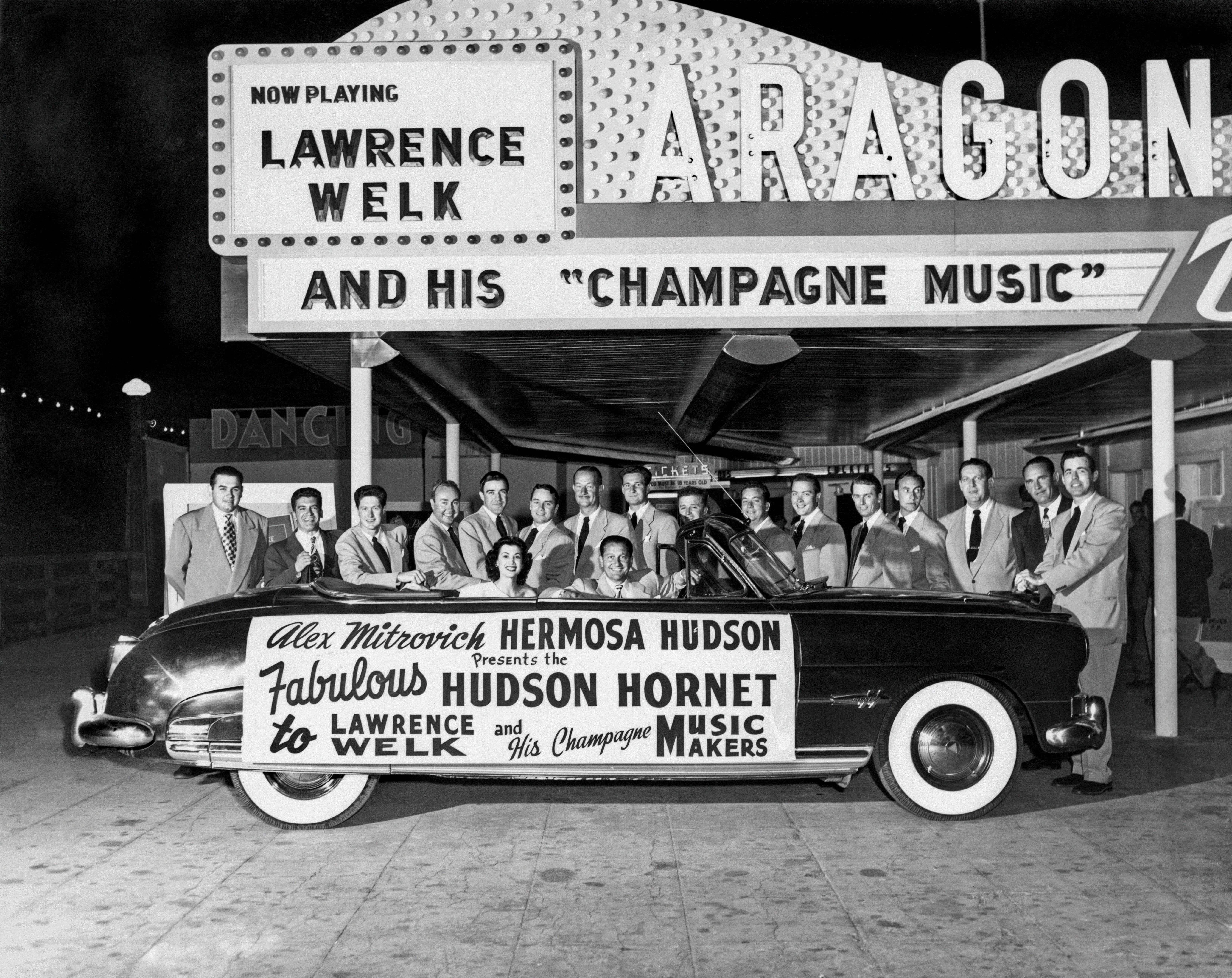 Lawrence Welk and his band with a Hudson Hornet at the Aragon Ballroom in Santa Monica.