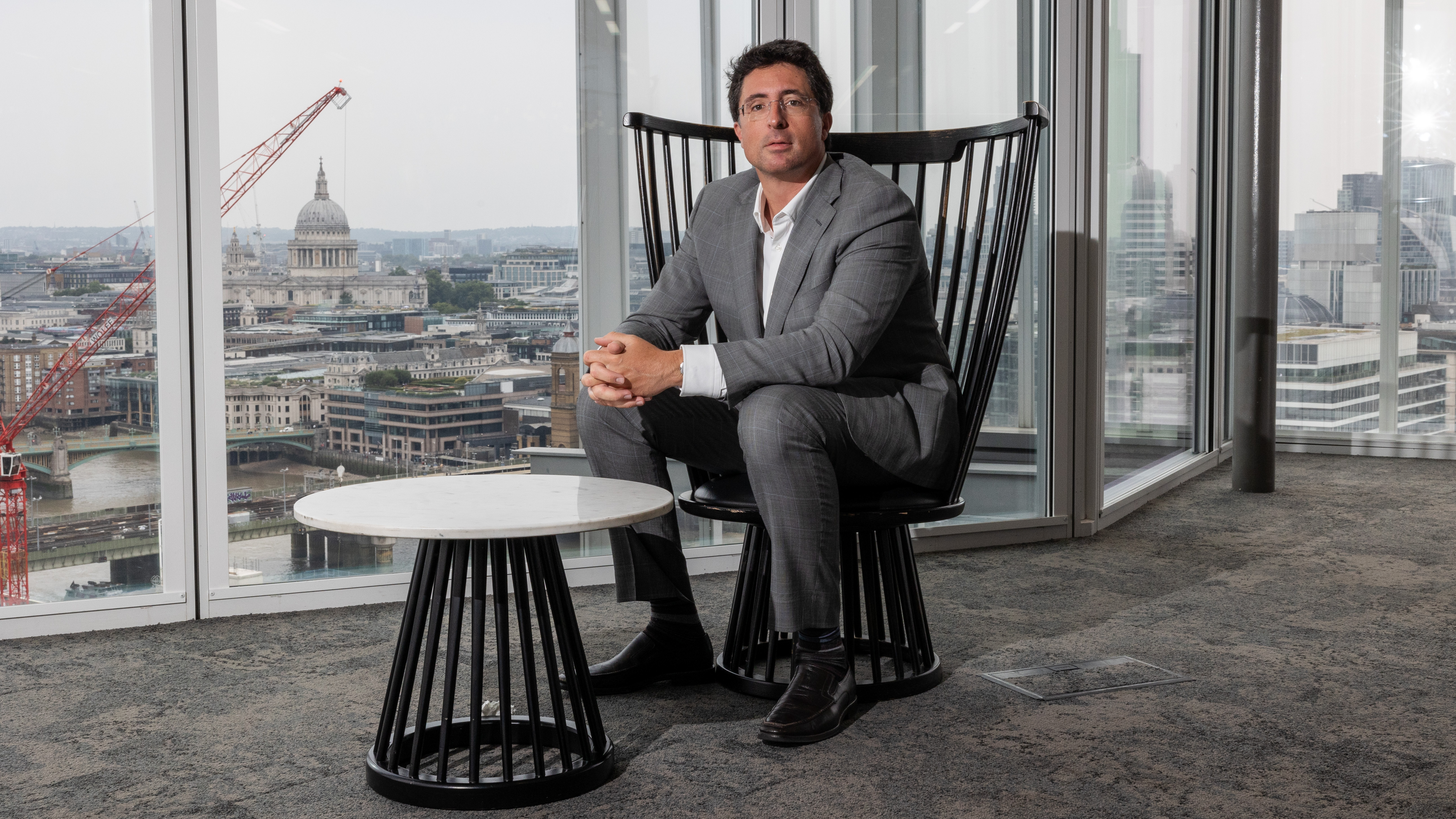 Niccolo de Masi, CEO of IonQ, sits in a chair before a podcast recording.