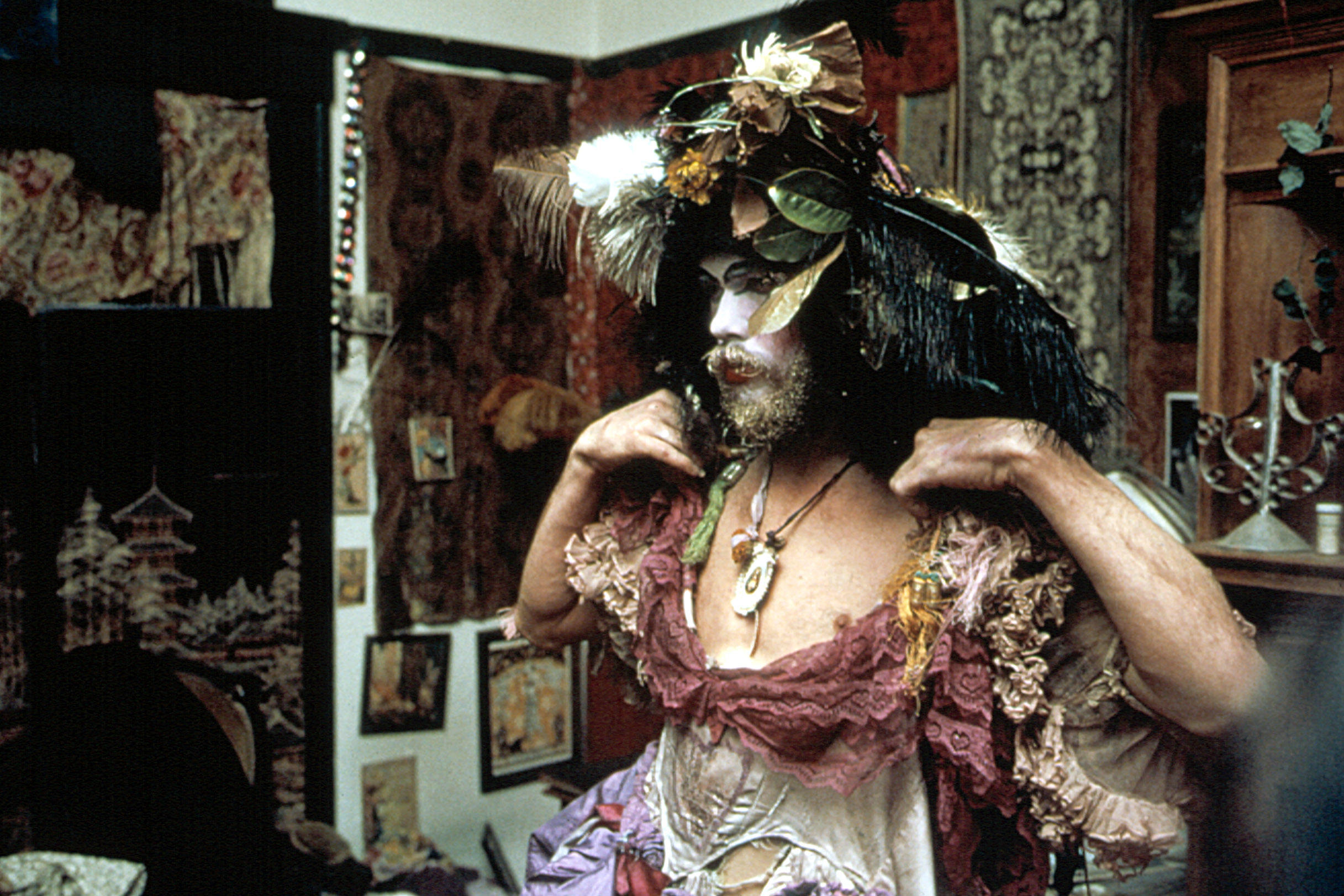 Person in elaborate costume and headdress.