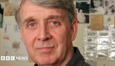 Portrait of Allan Ahlberg staring directly at the camera. He has blue eyes and grey hair.