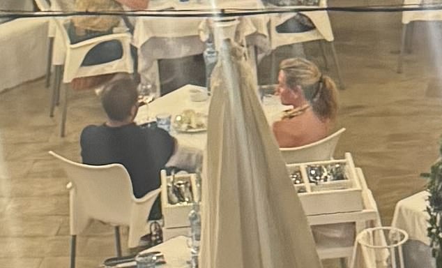 According to fellow diners at the picturesque eatery called Chiringuito de Garraf, the presenter appeared 'downcast' while wearing a halter neck dress and golden sandals, as she tucked into her meal, believed to be lobster