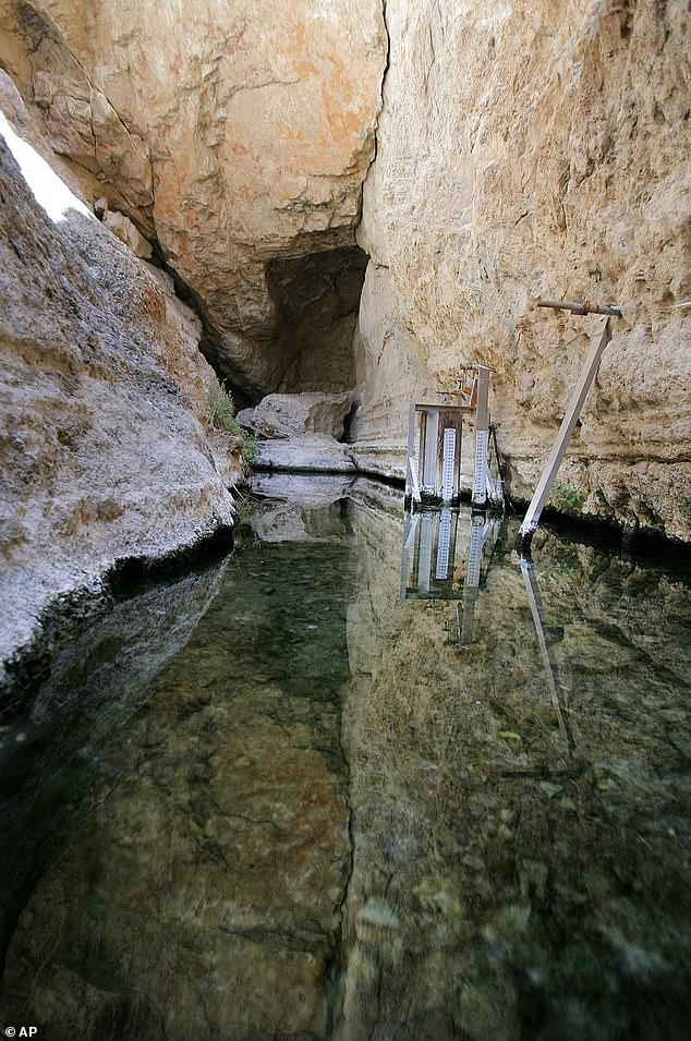 Devil's Hole (pictured), which falls under the jurisdiction of Death Valley National Park, is about 12 feet wide and more than 500 feet deep