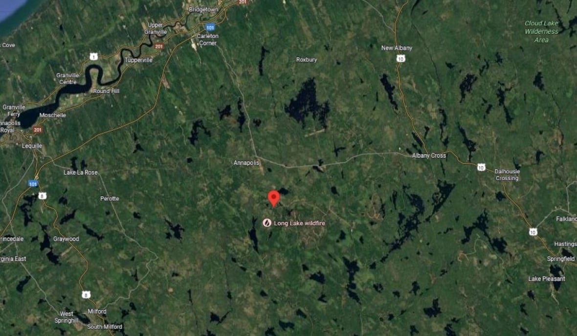 A map shows the location of the plane crash in a remote, forested area.