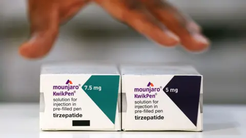 Photo by ANDY RAIN/EPA/Shutterstock Photo of two boxes. They are labelled 'Mounjaro KwikPen'. The box on the left is 7.5mg and the one on the right is 5mg'.