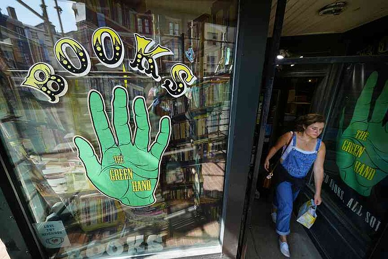A customer leaves the Green Hand Bookstore in Portland, Maine, on Thursday, Aug. 7, 2025. (AP Photo/Robert F. Bukaty)