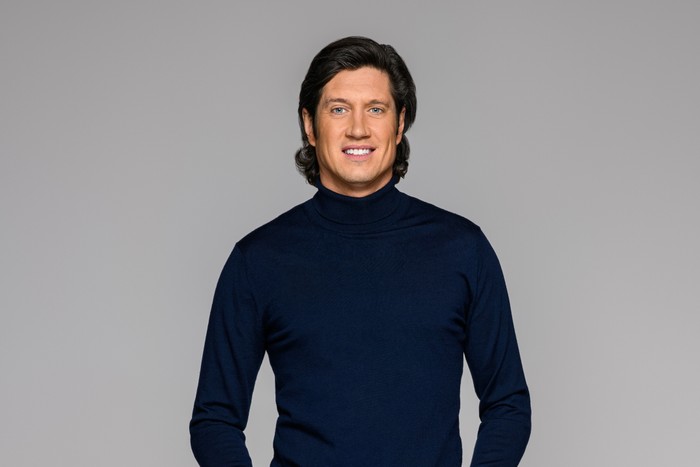 Vernon Kay Vernon Kay wearing a blue turtleneck, smiling ahead.