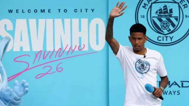 Manchester City's new Brazilian forward Savinho waves
